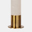 Table lamp with alabaster column body sitting on Industrial gold base & tapered white linen shade. Detail of base.