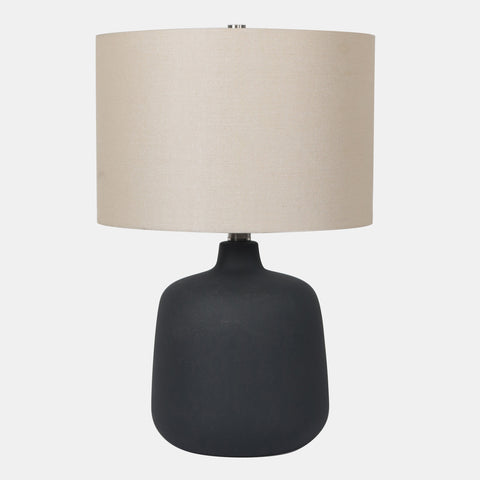 Ceramic Table Lamp with beige drum shade, and black vase-shaped base.
