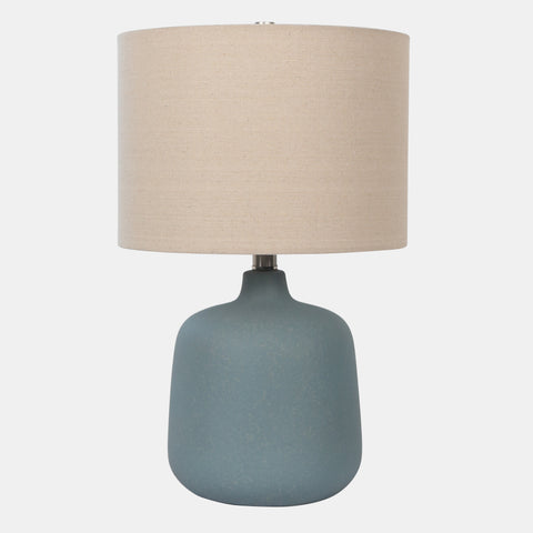 Ceramic Table Lamp with beige drum shade, and blue vase-shaped base.