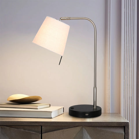 Stainless Steel arm & off-white linen shade task lamp with a black base including a USB port on a desk