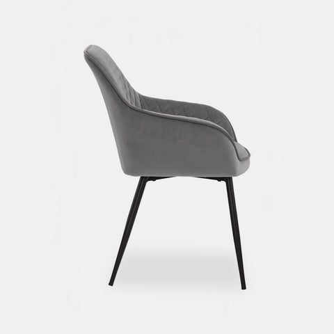 Scandinavian style dining chair in grey velvet and black metal legs.