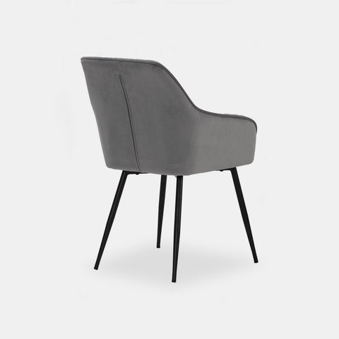 Scandinavian style dining chair in grey velvet and black metal legs.