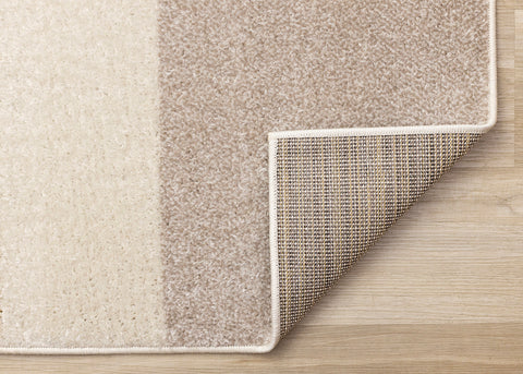 Malibu Rug - Curvy Geometric Taupe Yellow corner flipped to show underside