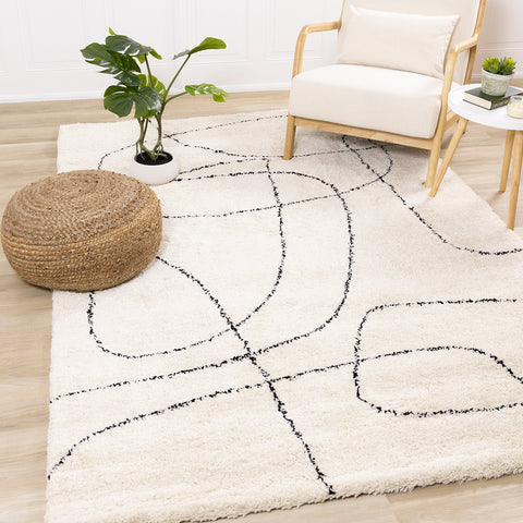 Maroq Shag Rug - Cream / Black Lines in living room setting