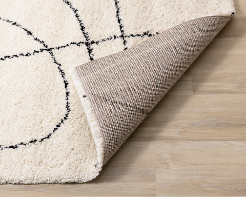 Maroq Shag Rug - Cream / Black Lines corner flipped to show underside