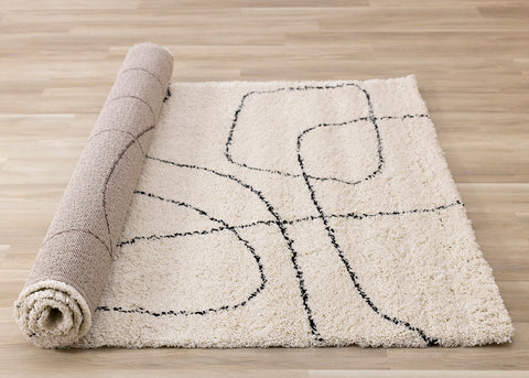 Maroq Shag Rug - Cream / Black Lines roll on floor