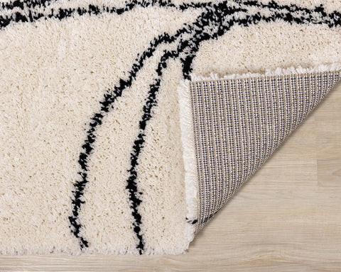 Maroq Shag Rug - Cream & Taupe Vines corner flipped to show underside