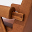 Caramel brown leather lounge chair with leather armrests and solid ash wood legs stained walnut. Armrest detail.