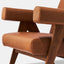 Caramel brown leather lounge chair with leather armrests and solid ash wood legs stained walnut. Front Seat detail.