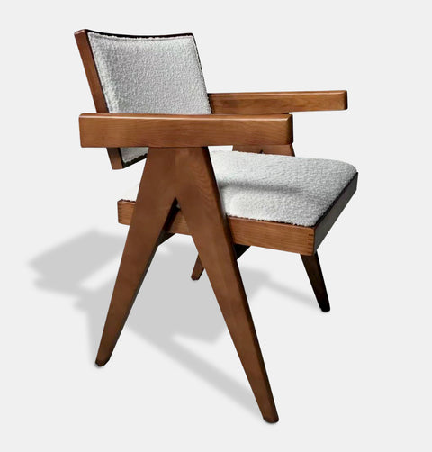 Solid ash wood dining chair stained in walnut with off white bouclé fabric seat and back. 