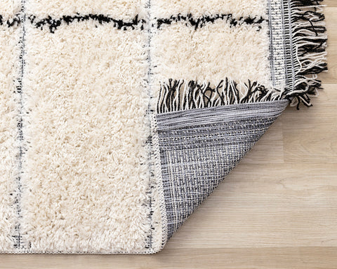 Novato Rug - Black Stripes corner flipped to show underside