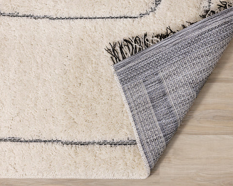 Novato Dual Texture Rug - Wavy Lines corner flipped to show underside