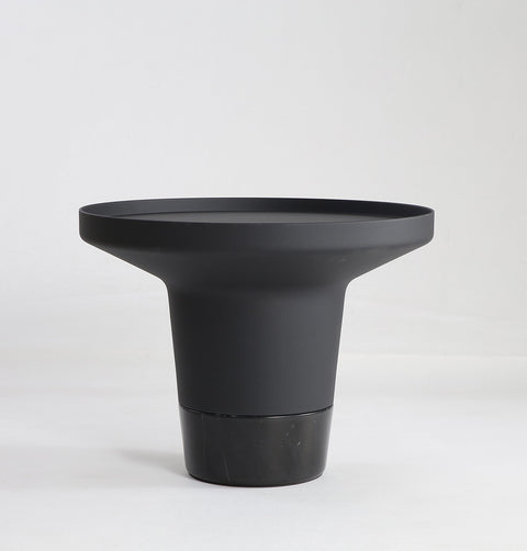 Minimal black powder coated aluminum side table resembling a pier bollard with a black marble base.