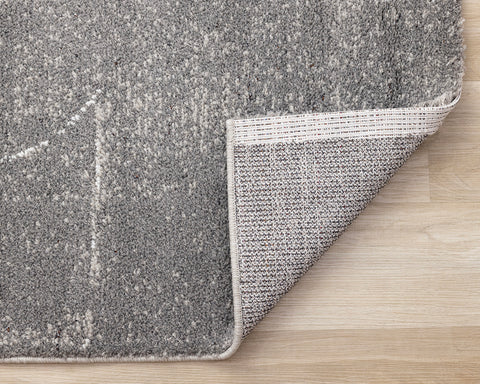 Ravine Rug - Grey Cream Strokes corner flipped to show underside