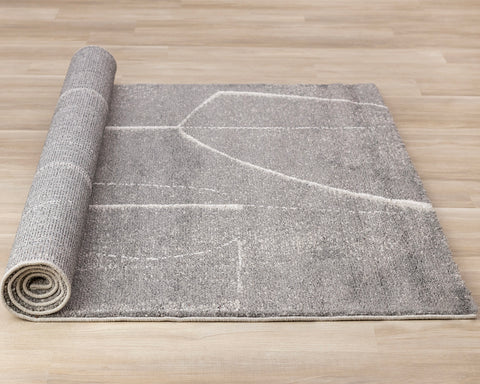 Ravine Rug - Grey Cream Strokes roll on floor