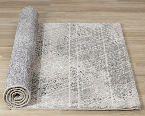 Ravine Rug - Grey Cream Distressed Lines roll on floor