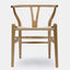 Hans Wegner inspired dining chair in natural ash with natural cord woven seat.