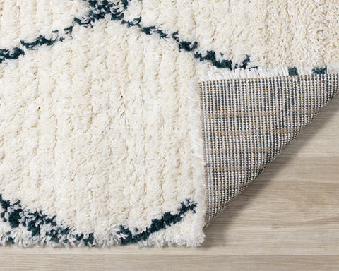 Rondo Distressed Rug - Diamonds corner flipped to show underside