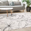 Safi Rug - Grey Flowers in living room setting