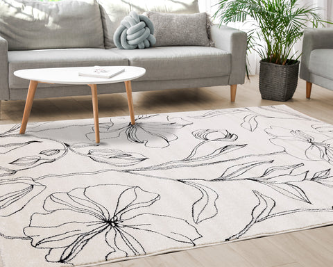 Safi Rug - Grey Flowers in living room setting