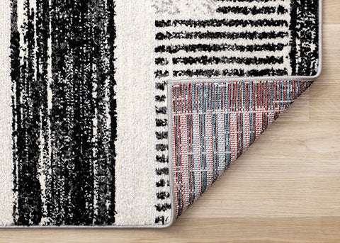 Swift Rug - Patterned Lines corner flipped to show underside