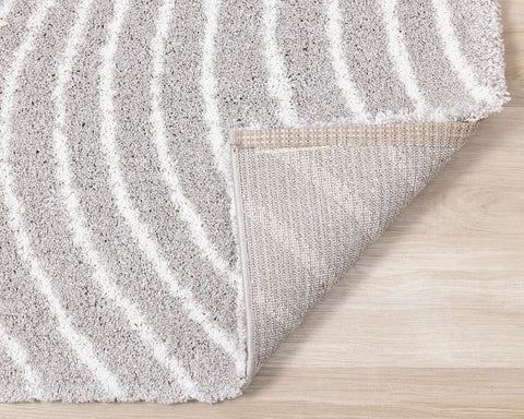 Shira Soft Touch Rug - Grey Waves corner flipped to show underside