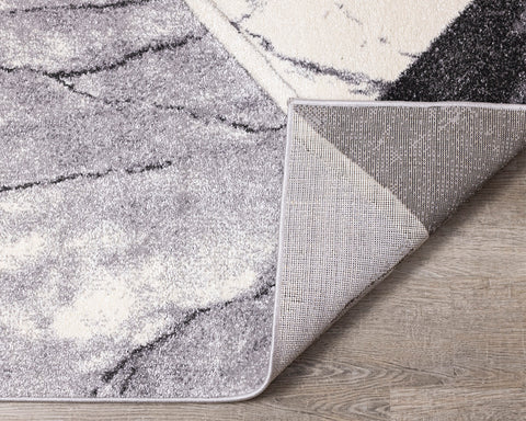 Soho Rug - Geometric Marble corner flipped to show underside