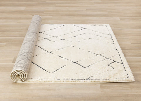 Talia Rug - White Broken Lattice roll on floor