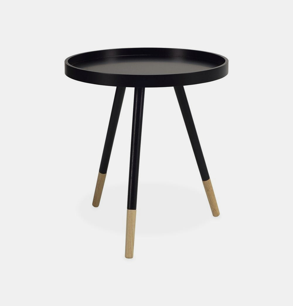 Black round side table with 3 white painted oak legs including exposed natural finish at base. 