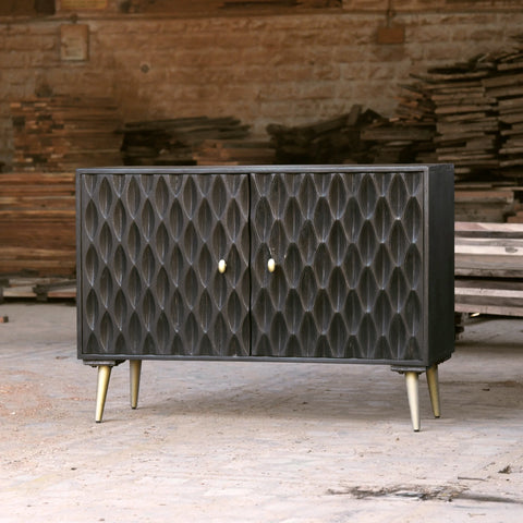Solid mango wood sideboard in grey finish with golden iron legs in mid-century style. CNC carved detailed doors.