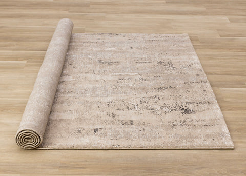 Zola Distressed Rug - Beige Cream roll on floor