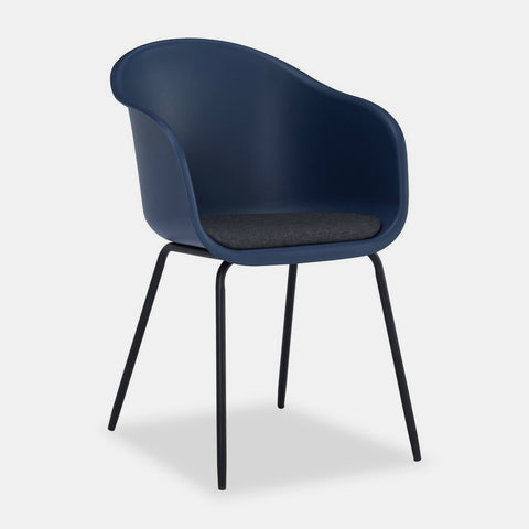 Midnight blue plastic Scandinavian style dining chair with black metal legs and dark grey cushioned seat.