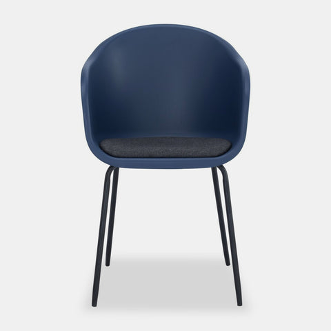 Midnight blue plastic Scandinavian style dining chair with black metal legs and dark grey cushioned seat.