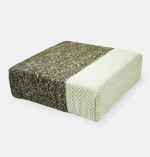 Handmade wool braided square floor pouf in natural grey with offset white braiding.