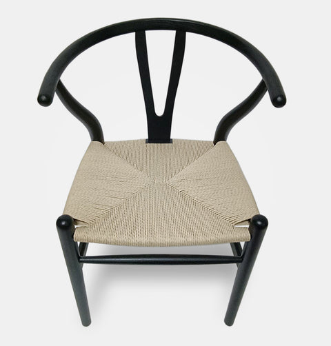 Hans Wegner inspired dining chair in black stained ash with natural cord woven seat.