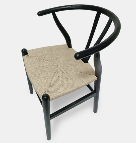 Hans Wegner inspired dining chair in black stained ash with natural cord woven seat.