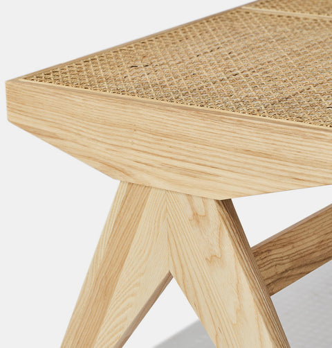 Solid natural ash wood bench with solid frame and woven natural rattan seat.