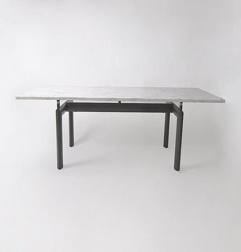 Dining table with Carrara marble top and black metal legs.