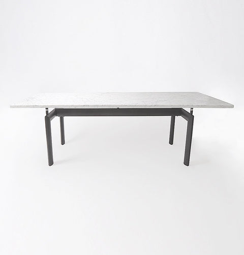 Dining table with Carrara marble top and black metal legs.
