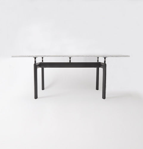 Dining table with Carrara marble top and black metal legs.