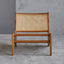 Lounge chair in walnut stained ash wood frame with natural rattan seat and back.