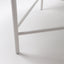 Metal leg detail of 32" diameter white marble coffee table