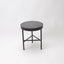 Side table with dark green marble top and black metal frame with 3 legs.