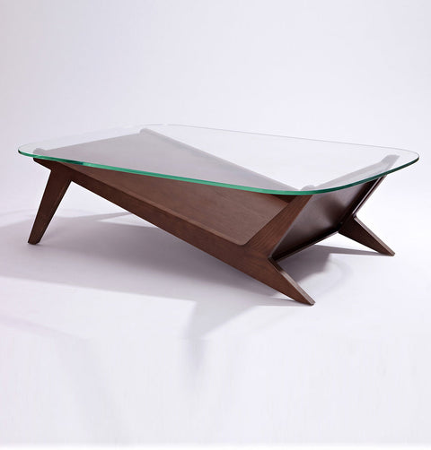 Coffee table with tempered glass top and walnut stained solid ash wood legs. Solid wood shelving in a check mark shape follows the leg contour.