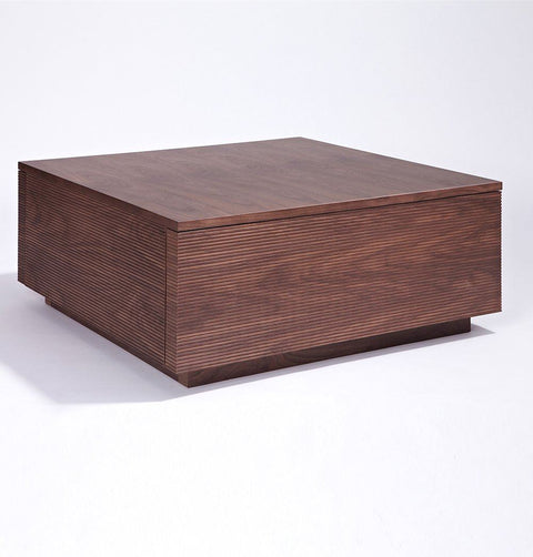 Coffee table in walnut veneer with 2 drawers, and lined ribbing detail.